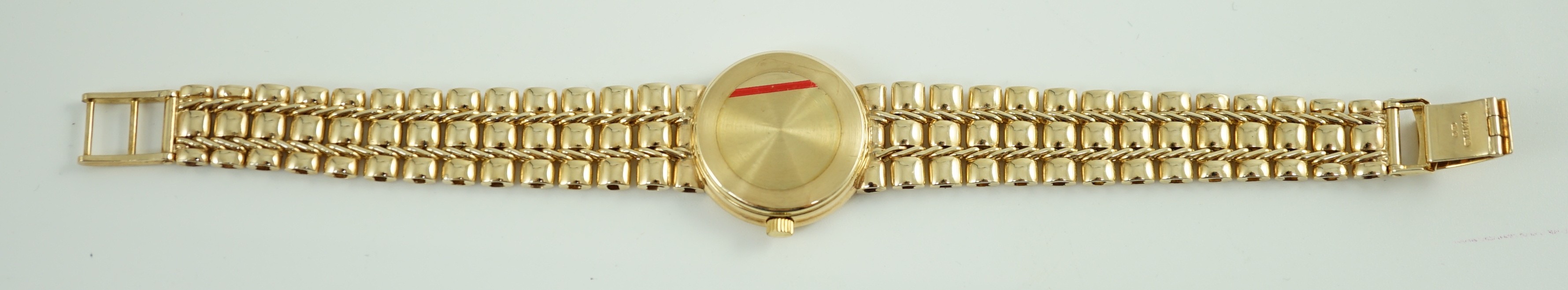 A lady's 2002 9ct gold Asprey & Garrard quartz wrist watch, on a 9ct gold bracelet